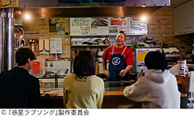 記事写真。西村瑞樹さん演じるお好み焼き屋店主・スケザネ